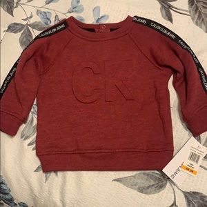 Red Calvin Klein baby sweatshirt